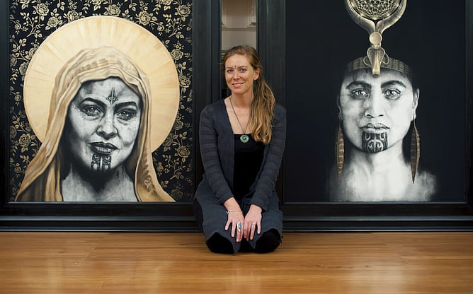 Sofia Minson before Queen of Raa and Rose of the Cross original paintings in her studio, New Zealand artist with large scale Māori portrait works available for private collection