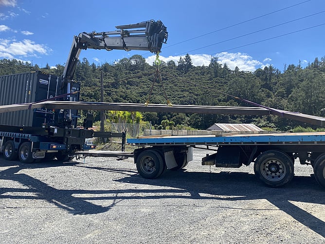 Loading structural steel for installation at Paku Tairua