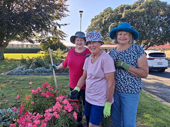 From left: Cherie Thom, Gaye Cooper, and Chris Futter hard at work outside Pukekohe Hospital. Times photo Helena O&rsquo;Neill