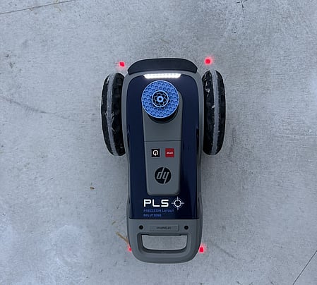 The PLS site print robot at work on a concrete slab.