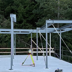 PLS siteprint at work at night on a concrete slab.