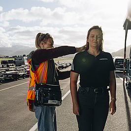 Laura on-set working on a models hair.