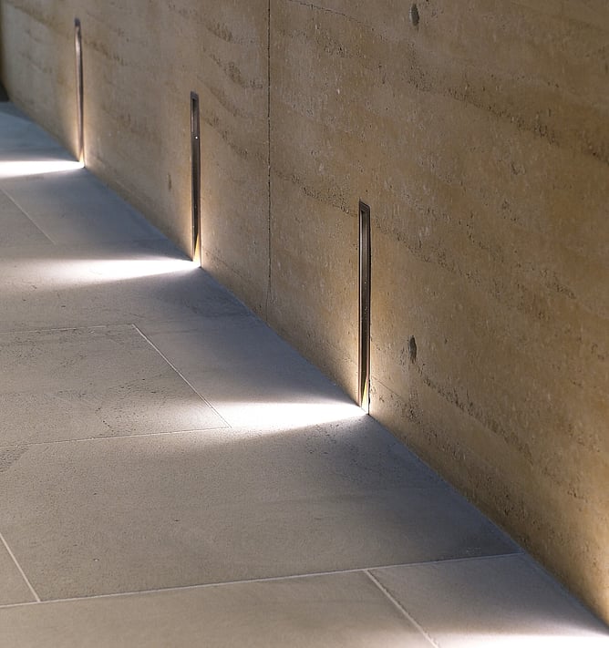 Architectural concrete wall with integrated lighting detail in high-end home