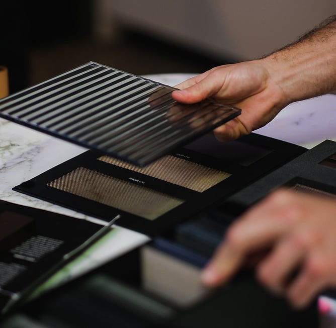 Comparing material samples in showroom New Zealand