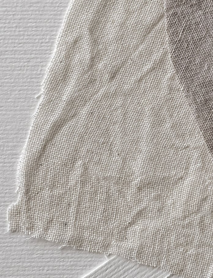 layered linen fabrics on Fabriano paper, showing linen weave, texture and soft frayed edges